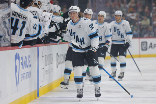 Utah Mammoth center Logan Cooley (92) is congratulated after scoring during the first period of an NHL hockey game against the Minnesota Wild, Saturday, Oct. 25, 2025, in St. Paul, Minn. (AP Photo/Bailey Hillesheim)