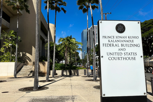 FILE - A sign for the Prince Jonah Kuhio Kalanianaole Federal Building and Courthouse is displayed outside the courthouse on Jan. 22, 2024, in Honolulu. (AP Photo/Jennifer Kelleher, File)