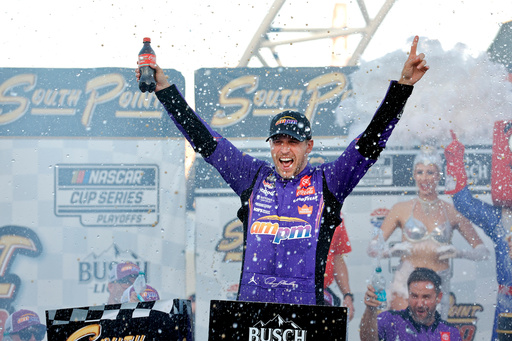 Denny Hamlin celebrates in victory lane after winning a NASCAR Cup Series auto race Sunday, Oct. 12, 2025, in Las Vegas. (AP Photo/Steve Marcus)
