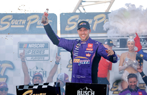 Denny Hamlin celebrates in victory lane after winning a NASCAR Cup Series auto race Sunday, Oct. 12, 2025, in Las Vegas. (AP Photo/Steve Marcus)