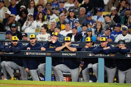 Members of the Milwaukee Brewers watch during the eighth inning in Game 4 of baseball's National League Championship Series against the Los Angeles Dodgers, Friday, Oct. 17, 2025, in Los Angeles. (AP Photo/Ashley Landis)