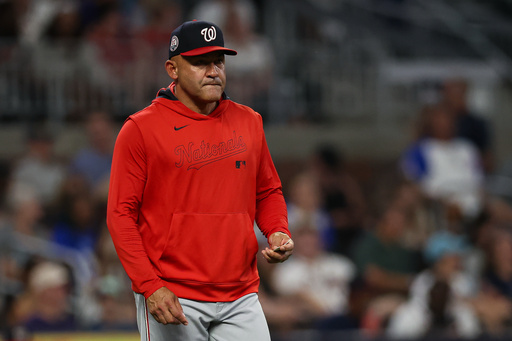 FILE - Washington Nationals interim manager Miguel Cairo walks out to the mound to make a pitching change in the seventh inning of a baseball game against the Atlanta Braves, Tuesday, Sept. 23, 2025, in Atlanta. (AP Photo/Colin Hubbard, File)
