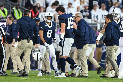 Penn State quarterback Drew Allar (15) walks off the field injured during the fourth quarter of an NCAA college football game against Northwestern, Saturday, Oct. 11, 2025, in State College, Pa. (AP Photo/Barry Reeger)