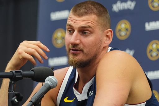 Denver Nuggets center Nikola Jokic responds to questions during an NBA basketball media day news conference Monday, Sept. 29, 2025, in Denver. (AP Photo/David Zalubowski)