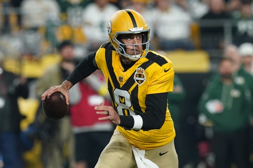 Pittsburgh Steelers' Aaron Rodgers scrambles during the first half of an NFL football game against the Green Bay Packers Sunday, Oct. 26, 2025, in Pittsburgh. (AP Photo/Matt Freed)
