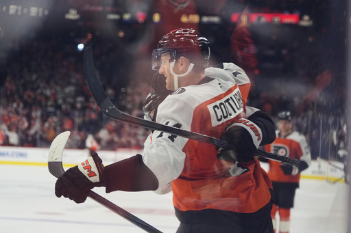 Philadelphia Flyers' Sean Couturier celebrates after scoring past Florida Panthers goaltender Daniil Tarasov during the second period of an NHL hockey game, Monday, Oct. 13, 2025, in Philadelphia. (AP Photo/Matt Rourke)