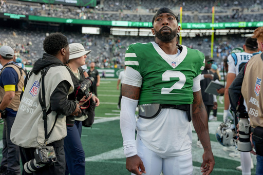 New York Jets quarterback Tyrod Taylor (2) walks off the field after the Jets lost to the Carolina Panthers in an NFL football game, Sunday, Oct. 19, 2025, in East Rutherford, N.J. (AP Photo/Angelina Katsanis)
