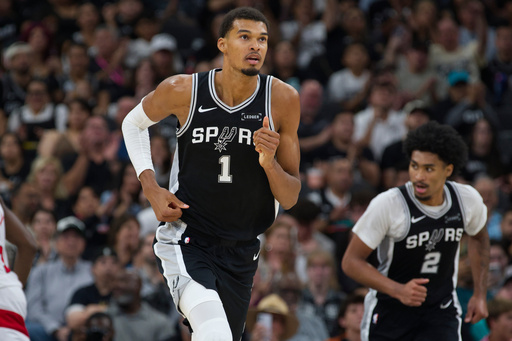 San Antonio Spurs center Victor Wembanyama (1) runs up-court during the second half of an NBA basketball game against the Toronto Raptors, Monday, Oct. 27, 2025, in San Antonio. (AP Photo/Darren Abate)