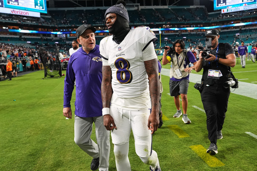 Baltimore Ravens quarterback Lamar Jackson (8) leaves the field after a win over the Miami Dolphins in an NFL football game, Thursday, Oct. 30, 2025, in Miami Gardens, Fla. (AP Photo/Lynne Sladky)
