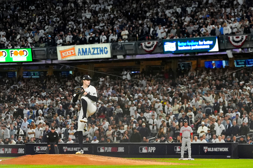 New York Yankees pitcher Cam Schlittler delivers against the Boston Red Sox during the eighth inning of Game 3 of an American League wild-card baseball playoff series, Thursday, Oct. 2, 2025, in New York. (AP Photo/Yuki Iwamura)