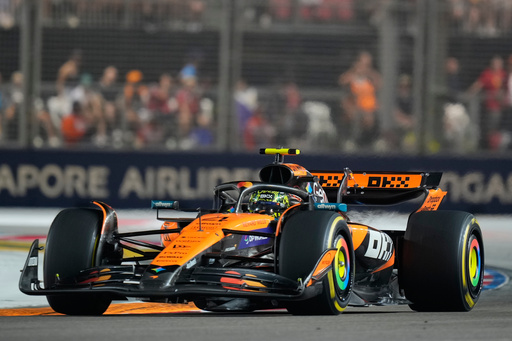 McLaren driver Lando Norris of Britain steers his car during the Singapore Formula One Grand Prix at the Marina Bay Street Circuit in Singapore, Sunday, Oct. 5, 2025. (AP Photo/Vincent Thian)