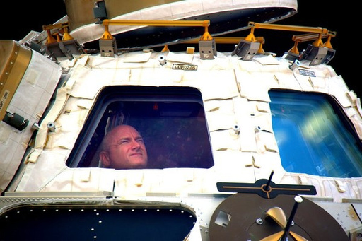 FILE - In this undated photo provided by NASA on Tuesday, March 1, 2016, astronaut Scott Kelly looks out the cupola of the International Space Station. (NASA via AP, File)
