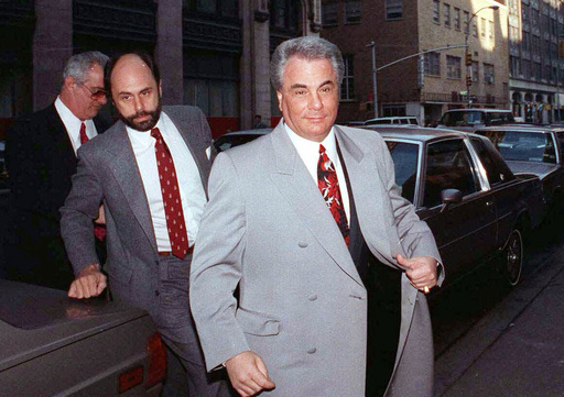FILE - John Gotti, right, arrives at court with his attorney Attorney Gerald Schargel, center, and his brother Peter Gotti, left, on Feb.9, 1990, in New York. (AP Photo/David Cantor, File)