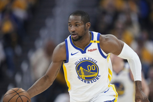 FILE - Golden State Warriors forward Jonathan Kuminga dribbles against the Minnesota Timberwolves during Game 3 of an NBA basketball second-round playoff series May 10, 2025, in San Francisco. (AP Photo/Godofredo A. Vásquez, File)