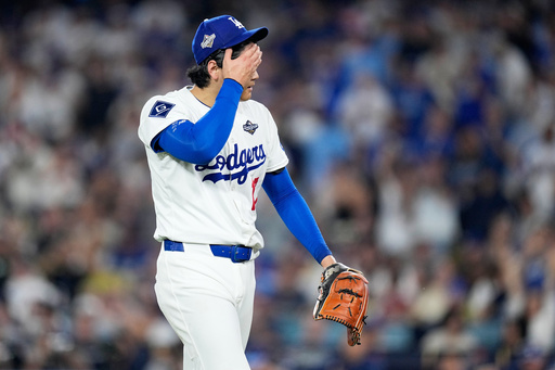 Los Angeles Dodgers pitcher Shohei Ohtani walks to the dugout after striking out Toronto Blue Jays' Alejandro Kirk during the sixth inning in Game 4 of baseball's World Series, Tuesday, Oct. 28, 2025, in Los Angeles. (AP Photo/Brynn Anderson)