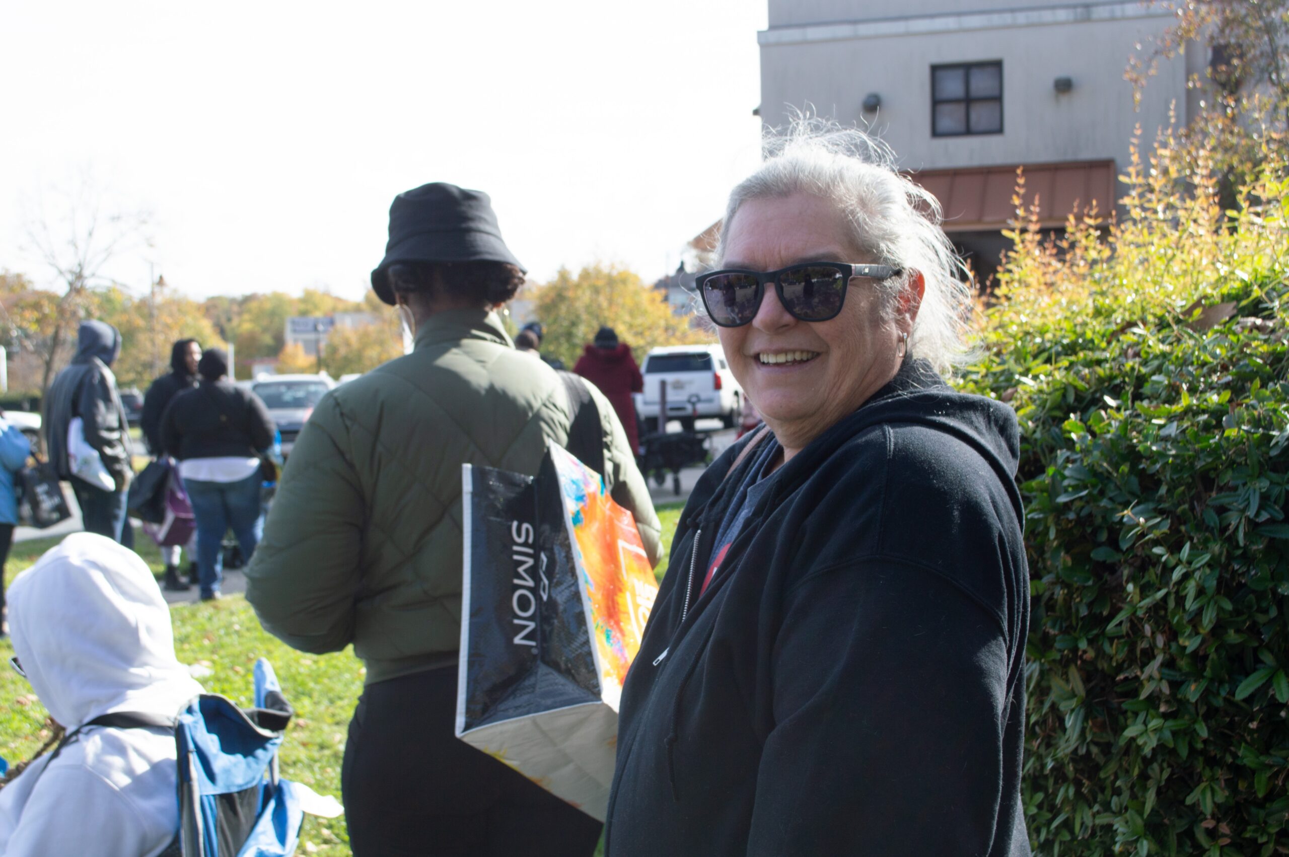 Ginette Young, a 61-year-old auditor for the U.S. Department of Agriculture, waits in line for a special Capital Area Food Bank distribution to furloughed federal workers on Tuesday, Oct. 28, 2025. (Photo by Ashley Murray)