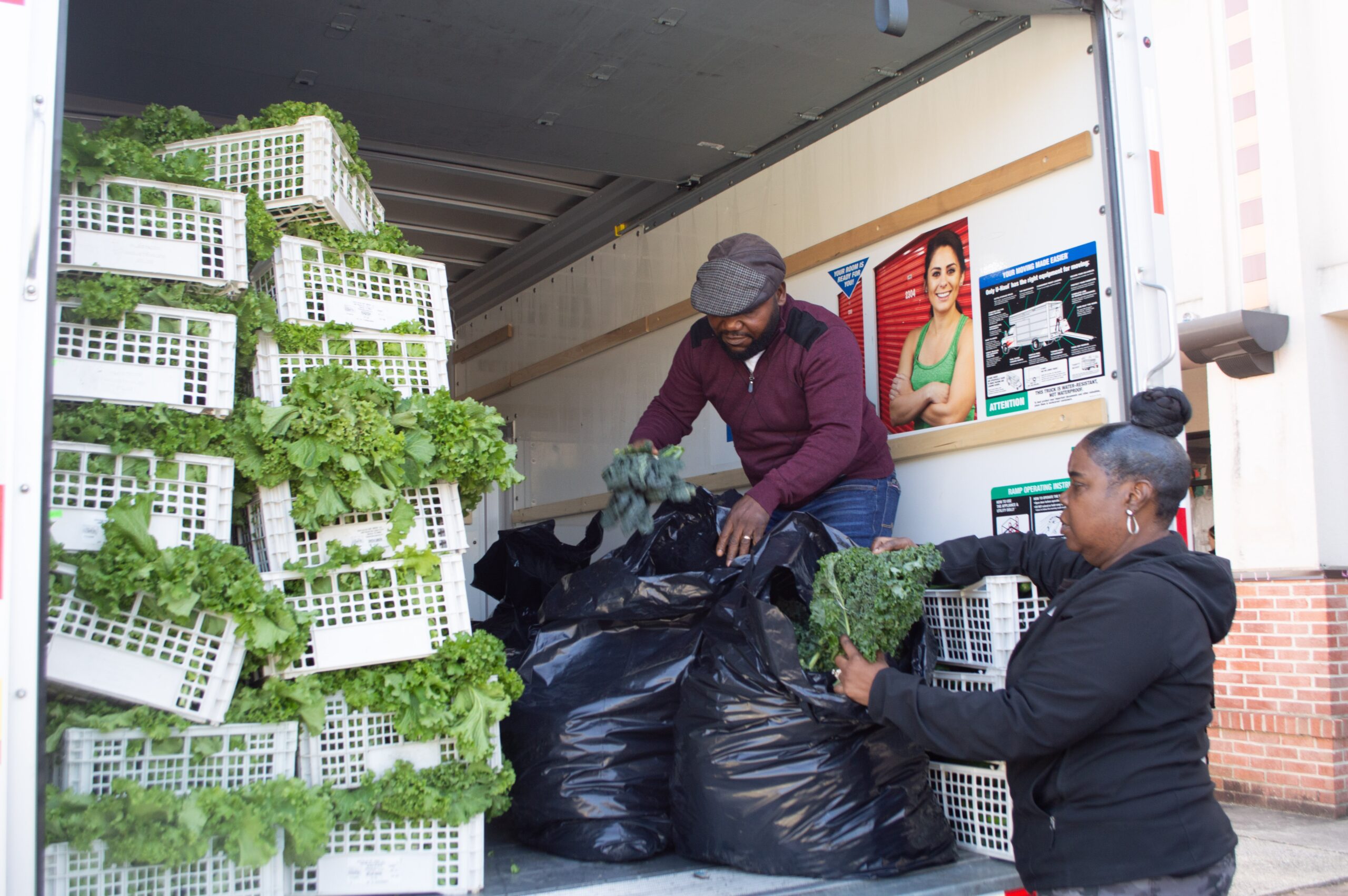 Tracy Bryce, 59, of District Heights, Maryland, unloads produce from a moving truck at a special food distribution for furloughed federal workers sponsored by the Capital Area Food Bank and No Limits Outreach Ministries on Tuesday, Oct. 28, 2025. (Photo by Ashley Murray/States Newsroom)