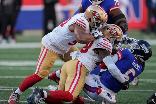 New York Giants quarterback Jaxson Dart (6) is tackled by San Francisco 49ers linebacker Tatum Bethune (48) during the third quarter of an NFL football game, Sunday, Nov. 2, 2025, in East Rutherford, N.J. (AP Photo/Seth Wenig)