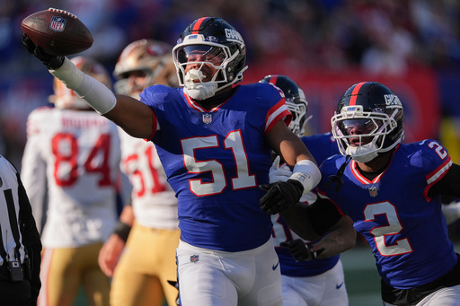New York Giants linebacker Abdul Carter (51) reacts after recovering a fumble by the San Francisco 49ers during the second quarter of an NFL football game, Sunday, Nov. 2, 2025, in East Rutherford, N.J. (AP Photo/Seth Wenig)