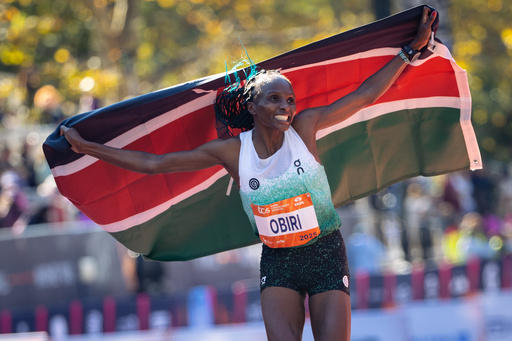 Hellen Obiri celebrates winning first place in the women's elite division of the New York City Marathon, Sunday, Nov. 2, 2025, in New York. (AP Photo/Angelina Katsanis)