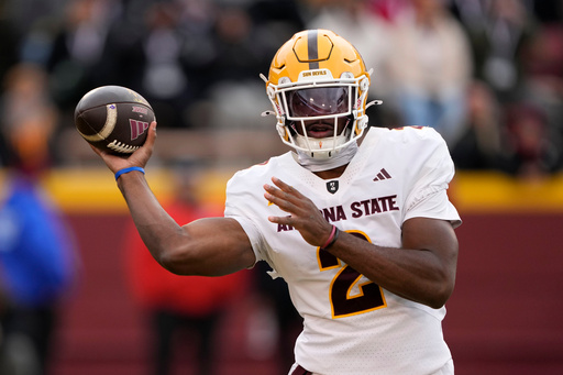 Arizona State quarterback Jeff Sims throws a pass during the first half of an NCAA college football game against Iowa State, Saturday, Nov. 1, 2025, in Ames, Iowa. (AP Photo/Charlie Neibergall)