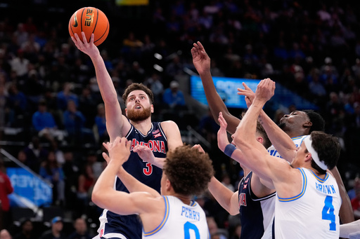 Arizona guard Anthony Dell'Orso (3) shoots as UCLA guard Trent Perry (0) defends during the first half of a Hall of Fame Series college basketball game Friday, Nov. 14, 2025, in Inglewood, Calif. (AP Photo/Mark J. Terrill)