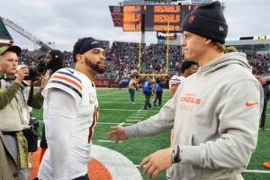 Cincinnati Bengals quarterback Joe Burrow (9), right, greets Chicago Bears quarterback Caleb Williams (18) after an NFL football game, Sunday, Nov. 2, 2025, in Cincinnati. (AP Photo/Jeff Dean)