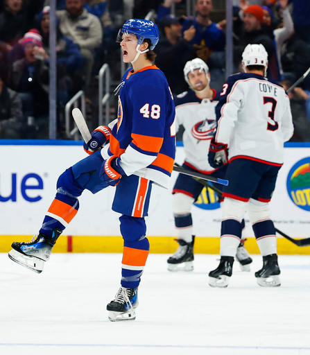 New York Islanders defenseman Matthew Schaefer (48) reacts after scoring against the Columbus Blue Jackets during the first period of an NHL hockey game, Sunday, Nov. 2, 2025, in New York. (AP Photo/Noah K. Murray)