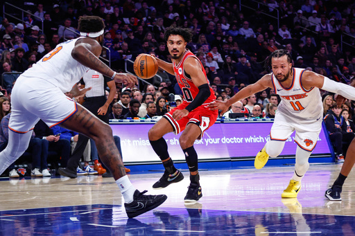 Chicago Bulls' Tre Jones (30) drives to the basket against New York Knicks' Jalen Brunson (11) during first half of an NBA basketball game against New York Knicks Sunday, Nov. 2, 2025, in New York. (AP Photo/Kena Betancur)