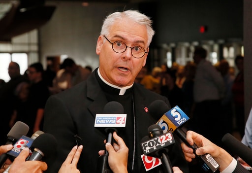 FILE - Archbishop Paul Coakley speaks to the media before the Beatification Ceremony for Stanley Rother in Oklahoma City, Sept. 23, 2017. (AP Photo/Sue Ogrocki, File)