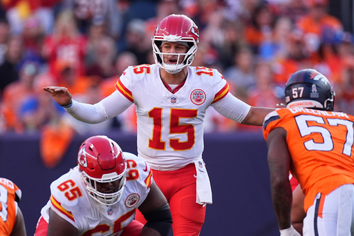 Kansas City Chiefs quarterback Patrick Mahomes (15) calls a play during the first half an NFL football game against the Denver Broncos Sunday, Nov. 16, 2025, in Denver. (AP Photo/David Zalubowski)