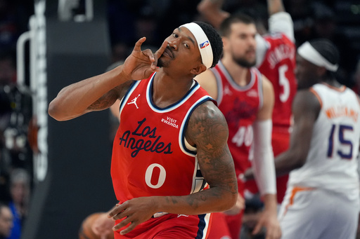 Los Angeles Clippers guard Bradley Beal celebrates a made 3-pointer against the Phoenix Suns during the first half of an NBA basketball game Thursday, Nov. 6, 2025, in Phoenix. (AP Photo/Ross D. Franklin)