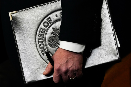 Speaker of the House Mike Johnson, R-La., holds a folder during a news conference on the Epstein Files Transparency Act, Tuesday, Nov. 18, 2025, at the U.S. Capitol in Washington. (AP Photo/Julia Demaree Nikhinson)