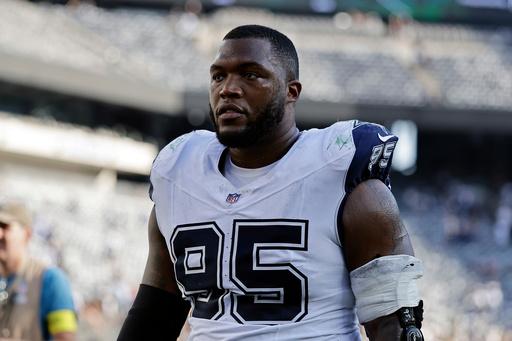 FILE - Dallas Cowboys nose tackle Kenny Clark (95) runs off the field after an NFL football game against the New York Jets, Oct. 5, 2025, in East Rutherford, N.J. (AP Photo/Adam Hunger, file)