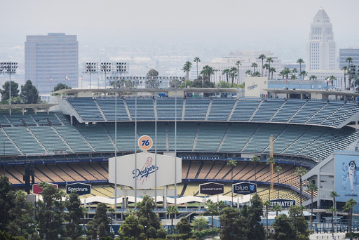 FILE - Dodger Stadium is shown before an evening baseball game, June 20, 2025, in Los Angeles. (AP Photo/Damian Dovarganes, File)