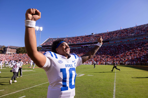 Duke quarterback Darian Mensah (10) celebrates after defeating Clemson in an NCAA college football game, Saturday, Nov. 1, 2025, in Clemson, S.C. (AP Photo/Scott Kinser)