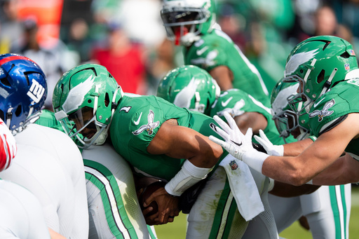 FILE - Philadelphia Eagles quarterback Jalen Hurts runs the "tush push" play during an NFL football game against the New York Giants, Oct. 26, 2025, in Philadelphia. (AP Photo/Chris Szagola, File)