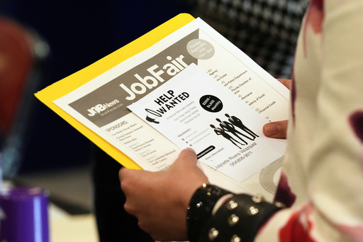 FILE - A job seeker waits to talk to a recruiter at a job fair Aug. 28, 2025, in Sunrise, Fla. (AP Photo/Marta Lavandier, File)