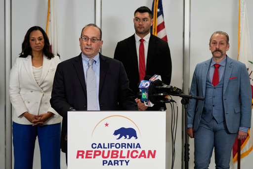 Dhillon Law Group partner Mike Columbo, second from left, speaks to reporters during a press conference announcing a federal lawsuit challenging Proposition 50, Wednesday, Nov. 5, 2025, in Sacramento, Calif. (AP Photo/Godofredo A. Vásquez)