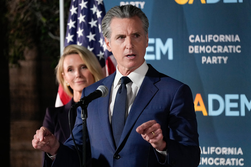 California Gov. Gavin Newsom speaks as he stands with first partner Jennifer Siebel Newsom during an election night press conference at a California Democratic Party office Tuesday, Nov. 4, 2025, in Sacramento, Calif. (AP Photo/Godofredo A. Vásquez)