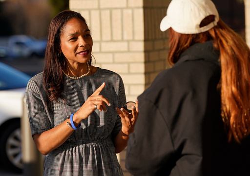Virginia House of Delegates, Del.-elect, Nicole Cole, left, speaks with constituent Kaitlyn Sapp, at a convince store Thursday, Nov. 13, 2025, in Fredericksburg, Va. (Steve Helber)