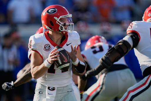 Georgia quarterback Gunner Stockton looks for a receiver during the first half of an NCAA college football game against Florida Saturday, Nov. 1, 2025, in Jacksonville, Fla. (AP Photo/John Raoux)
