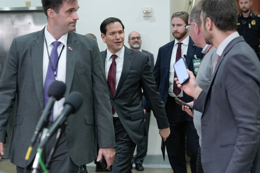 Secretary of State Marco Rubio, center, arrives to brief lawmakers on the U.S. military strikes on alleged drug boats ordered by President Donald Trump, on Capitol Hill, Wednesday, Nov. 5, 2025, in Washington. (AP Photo/Mariam Zuhaib)