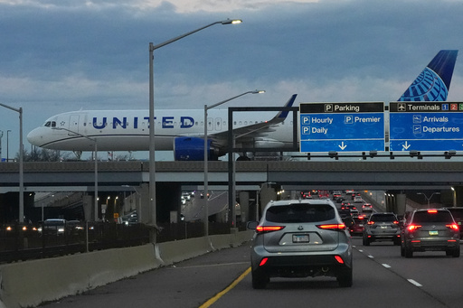 An United Airlines flight arrives at O'Hare International Airport in Chicago, Monday, Nov. 3, 2025. (AP Photo/Nam Y. Huh)