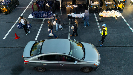 MUST Ministries delivers food to the public via a drive through service, Saturday, Nov. 1, 2025, in Austell, Ga. (AP Photo/Mike Stewart)