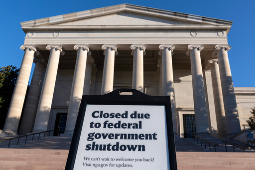 FILE - A sign that reads "Closed due to federal government shutdown," is seen outside of the National Gallery of Art on the 6th day of the government shutdown, in Washington, Oct. 6, 2025. (AP Photo/Jose Luis Magana, File)