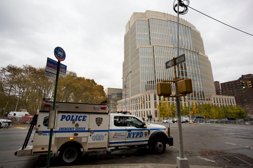 FILE - The New York Police Department has extra security in place in front of the Brooklyn Federal Courthouse for the start of jury selection in the trial of Joaquin "El Chapo" Guzman, Nov. 5, 2018, in New York. (AP Photo/Mark Lennihan, File)