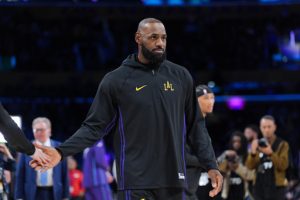 Los Angeles Lakers forward LeBron James warms up before the team's NBA basketball game against the Utah Jazz Tuesday, Nov. 18, 2025, in Los Angeles. (AP Photo/Jae C. Hong)