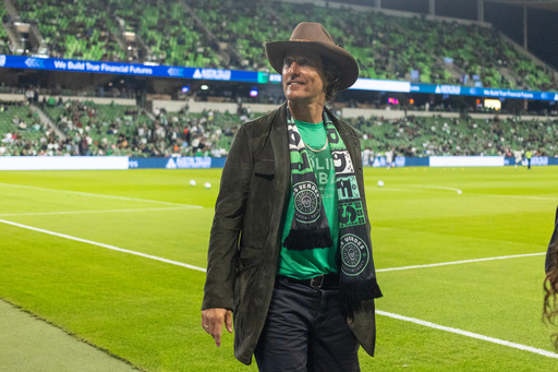Actor Matthew McConaughey acknowledges the fans as he walks a sideline before Game 2 in the first round of MLS soccer's Western Conference playoffs between Los Angeles FC and Austin FC, Sunday, Nov. 2, 2025, in Austin, Texas. (AP Photo/Stephen Spillman)