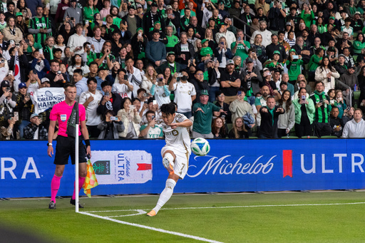Los Angeles FC forward Son Heung-Min (7) takes corner kick against Austin FC during the second half of Game 2 in the first round of MLS soccer's Western Conference playoffs Sunday, Nov. 2, 2025, in Austin, Texas. (AP Photo/Stephen Spillman)